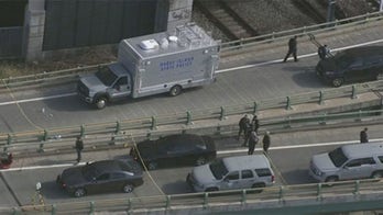 Providence police chase leaves 1 dead; manhunt underway for suspect who hijacked cruiser