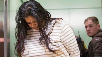 Indiana court tosses woman's feticide conviction