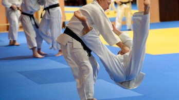 Russia plays crafty round of global martial arts under Putin