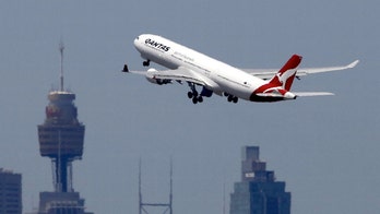 Qantas flight forced to turn around after passenger starts yelling, locks himself in plane bathroom 'for about an hour'