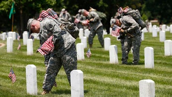 Soldiers placing 230,000 US flags at Arlington National Cemetery