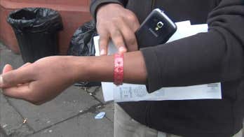 UK company criticized for forcing refugees to wear wristbands
