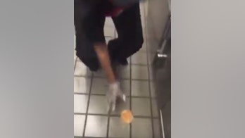 Checkers under fire after video shows employee wiping floor with a burger bun