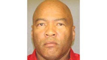 Feds say a lick of the envelope helped them catch bank robber