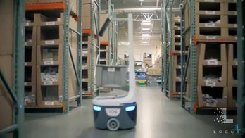 These robots can talk to one another to 'see' around factory corners