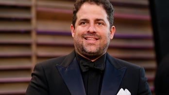 Brett Ratner splits with Warner Bros. as Hollywood director says he'll sue over rape claims