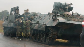 Armored tanks near Zimbabwe capital amid tension between Mugabe, military