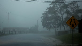 Belize drenched, dozens rescued as Earl weakens to tropical storm