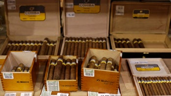 US removes limits on bringing in Cuban rum, cigars