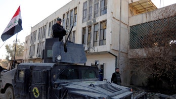 Iraqi forces raise flag at Mosul University in push against ISIS
