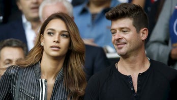 Robin Thicke's girlfriend April Love Geary hits back at breastfeeding photo criticism
