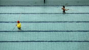 Water changes from green back to blue at troubled Olympic pool