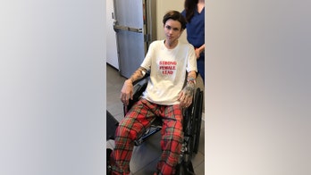 Ruby Rose in wheelchair after spine surgery