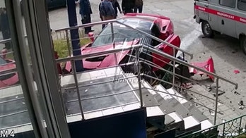 Security camera catches unlicensed Corvette driver crashing into Russian pawn shop