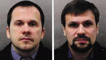 2 Russians charged over Novichok poisoning of ex-spy, used fake perfume bottle, British officials say