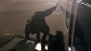 Ryanair passenger climbs out onto wing after waiting to deplane for half-hour