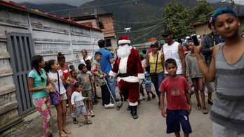 Venezuelan children acclimating to the idea of a meager, bankrupt Santa