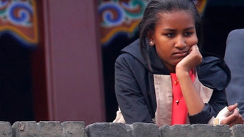 Obama daughters seem unimpressed on trip to China with first lady