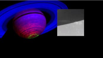 Cassini spots 'ghostly curtains of light' near Saturn's south pole