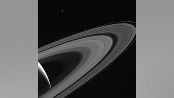 Saturn moon Tethys shines above rings in gorgeous photo