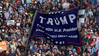 Student with ‘Trump’ flag assaulted by mob during National School Walkout