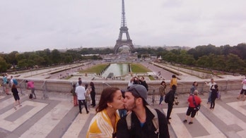 Couple's travel selfies find their way into music video glory