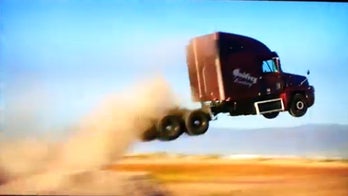 Daredevil goes for semi-truck jump record, falls with style