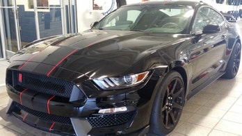 Car thieves crash Shelby Mustang through dealership door