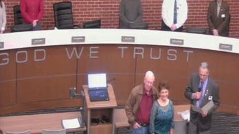 ACLU sues on behalf of atheist who opposed 'In God We Trust' display