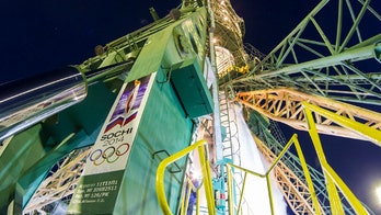 Olympic torch heads home after visit to International Space Station