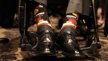 Former President George H.W. Bush honors late wife's commitment to literacy by wearing socks with books