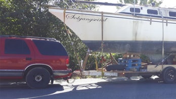 Police pull over SUV towing boat trailer made with wood pallets and duct tape
