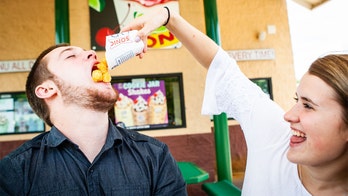 Couple who met at Sonic, bonded over tater tots, take engagement photos at fast-food chain