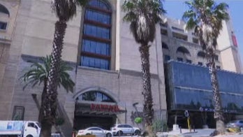 Banker's body found burned, strangled in South Africa hotel room