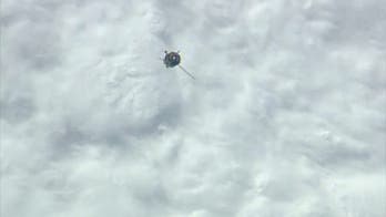 Russian Soyuz capsule reaches space station despite stuck solar array