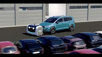 Meet Stan, a robot that can pick up your car and park it for you