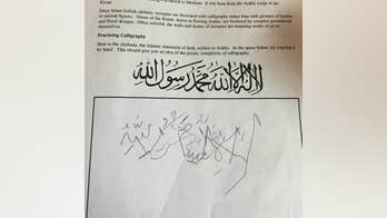 Students practice calligraphy by writing "There is no god but Allah"