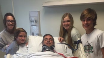 Georgia father paralyzed in body surfing accident determined to walk again