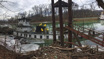 Crews cleaning oil leak from sunken West Virginia boat, Coast Guard says
