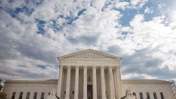 Justices mull appeal of Chicago suburb's assault weapons ban