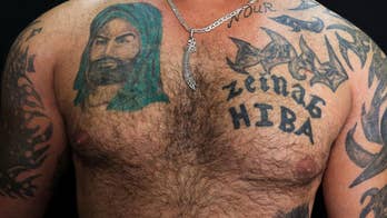 For Shiite Muslims, ink shows ‘deep love’ amid Syria’s civil war