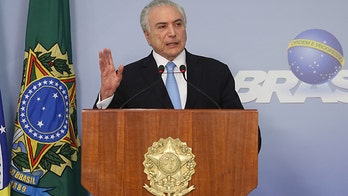 Brazil's embattled president survives vote on bribery charge