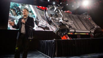 Tesla's 'D' adds all-wheel drive, safety features