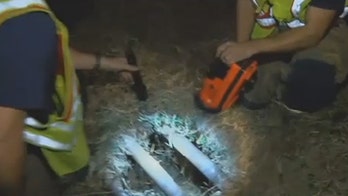 Infant ejected from flipped car found unharmed in drainage grate