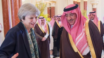 Theresa May visits Saudi Arabia without headscarf
