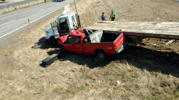 Pickup truck crushed by semi, but driver walks away