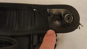Arizona officer's belt stops bullet in 'way too close a call' encounter