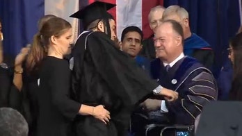 Paralyzed Georgetown linebacker walks across stage at graduation