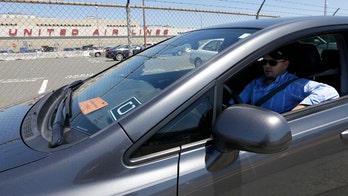 Uber settles two class-action suits, drivers to stay contractors