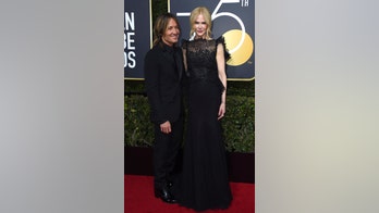Nicole Kidman and Keith Urban share an awkward kiss at the Golden Globes